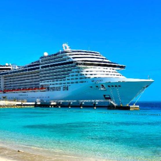 A cruise ship on a turquoise sea